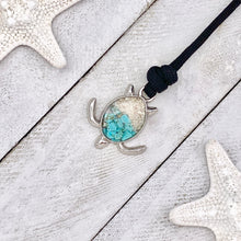 Load image into Gallery viewer, Black Rope Teal Sand Turtle Bracelet displayed on a white wooden surface.