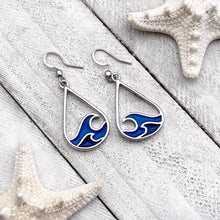 Load image into Gallery viewer, Curling Wave Earrings displayed on a white wooden surface.
