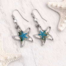 Load image into Gallery viewer, Deep In The Ocean Starfish Earrings displayed on a white wooden surface.