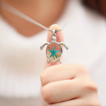 Load image into Gallery viewer, Deep in the Ocean Sea Turtle Necklace is shown up close.