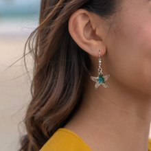Load image into Gallery viewer, Deep in the Ocean Starfish Earring displayed by being worn on a woman's ear.