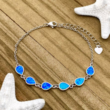 Load image into Gallery viewer, Opal Droplet Bracelet displayed on a wooden surface.