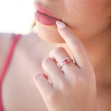 Load image into Gallery viewer, A hand positioned near a woman&#39;s lips is displaying the Opal Lobster Ring.