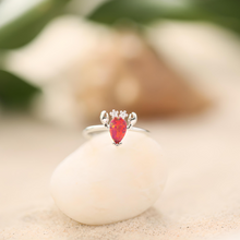 Load image into Gallery viewer, Opal Lobster Ring placed on top of a white rock with a blurred background.