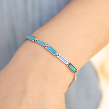 Load image into Gallery viewer, Opal Paradise Chain Bracelet displayed by being worn around a woman&#39;s wrist.