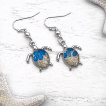 Load image into Gallery viewer, Sand Sea Turtle Earrings displayed on a white wooden surface.