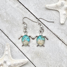Load image into Gallery viewer, Sand Sea Turtle Earrings displayed on a white wooden surface.