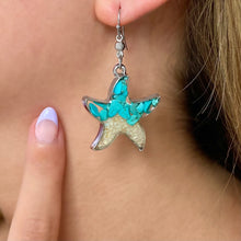 Load image into Gallery viewer, Sand Starfish Earrings worn on a woman's ear, ideal for ocean-inspired jewelry.