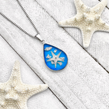 Load image into Gallery viewer, Under the Sea Necklace is displayed on a white wooden surface.