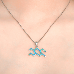 Opal Aquarius Necklace displayed closely by being worn around a woman's neck.