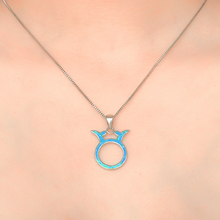 Load image into Gallery viewer, Opal Taurus Necklace displayed closely by being worn around a woman&#39;s neck.