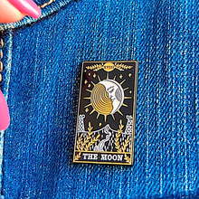 Load image into Gallery viewer, The Moon Tarot Card Pin displayed on denim cloth.