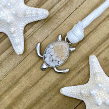 Load image into Gallery viewer, White Rope Sand Sea Turtle Bracelet in White Turquoise is displayed on a wooden surface.