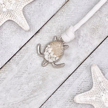Load image into Gallery viewer, White Rope Sand Sea Turtle Bracelet in White Turquoise is displayed on a white wooden surface.