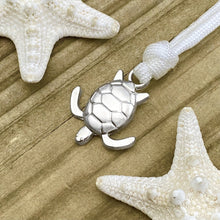 Load image into Gallery viewer, White Rope Sea Turtle Bracelet displayed on a wooden surface.