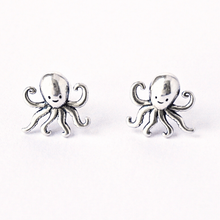 Load image into Gallery viewer, .925 Vintage Sterling Silver Octopus Studs are displayed on a rough white surface.