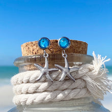Load image into Gallery viewer, Crystal Stud Starfish Earrings displayed on the cork of a bottle.