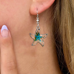 Deep In The Ocean Starfish Earring displayed by being worn on a woman's ear.