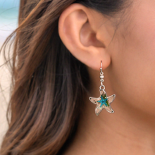 Load image into Gallery viewer, Deep in the Ocean Starfish Earrings displayed up close by being worn on a woman&#39;s ear.
