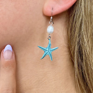 Freshwater Pearl Starfish Earring worn on a woman's ear, ideal for ocean-inspired jewelry.