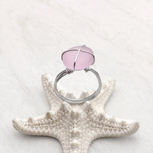 Load image into Gallery viewer, Hand-Wired Pink Sea Glass Ring is placed on top of a white dried artificial starfish.