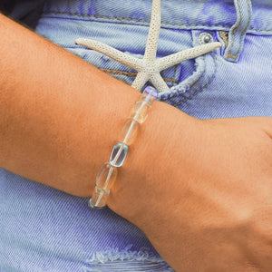 Iridescent Bead Bracelet displayed by being worn around a woman's wrist.