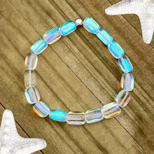 Load image into Gallery viewer, Iridescent Bead Bracelet displayed on a wooden surface.