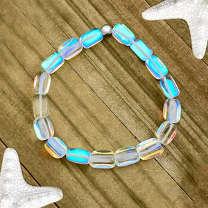 Iridescent Bead Bracelet displayed on a wooden surface.