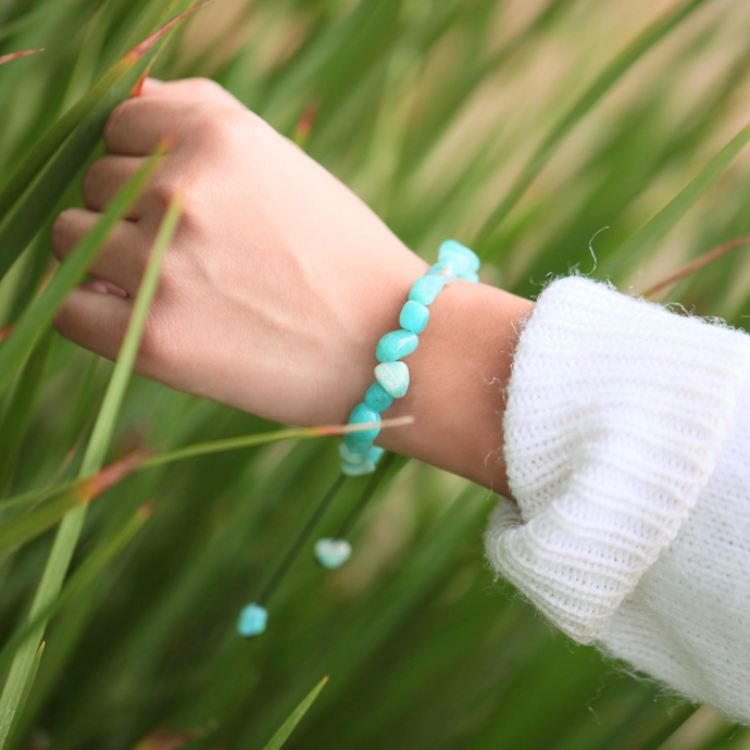 Larimar Bracelet displayed, worn around a woman's wrist with a grassy background.