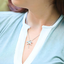 Load image into Gallery viewer, Larimar Palm Tree Necklace is displayed by being worn around a woman&#39;s neck.