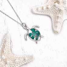 Load image into Gallery viewer, Malachite Sea Turtle Necklace displayed on a white wooden surface.