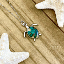 Load image into Gallery viewer, Malachite Sea Turtle Necklace displayed on a wooden surface.