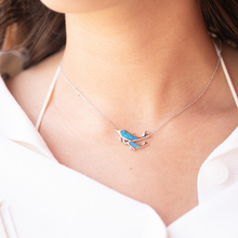 Load image into Gallery viewer, Opal Dolphin Duo Necklace worn around a woman&#39;s neck.