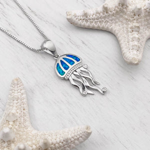 Opal Don't Be Jelly Necklace is positioned on top of a white wooden surface.