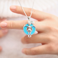 Load image into Gallery viewer, Opal Flotie Girl Necklace displayed up close, positioned by the hand.