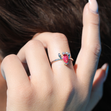 Load image into Gallery viewer, A woman&#39;s hand fixing her hair is displaying the Opal Lobster Ring.