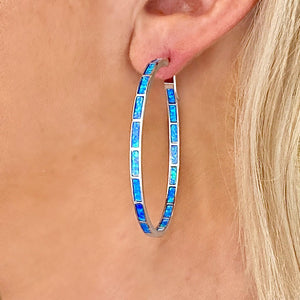 Opal Inlay Hoop Earring-XL is displayed by being worn on a woman's ear.