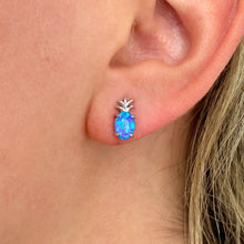 Load image into Gallery viewer, Opal Pineapple Stud Earrings worn on a woman&#39;s ear in a close-up shot.
