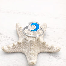 Load image into Gallery viewer, Opal Rip Curl Ring displayed by being placed on top of a white artificial starfish.