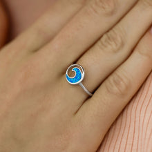 Load image into Gallery viewer, Opal Rip Curl Ring displayed by being worn on a woman&#39;s finger.