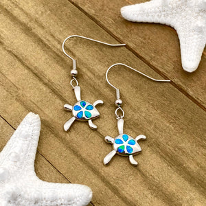 Opal Sea Turtle Flower Earrings displayed on a wooden surface, ideal for beach-inspired jewelry.