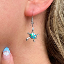 Load image into Gallery viewer, Opal Sea Turtle Flower Earrings worn on a woman&#39;s ear, perfect for ocean-themed jewelry.