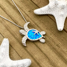 Load image into Gallery viewer, Opal Sea Turtle Starfish Necklace displayed on a wooden surface.