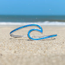 Load image into Gallery viewer, Opal Wave Cuff Bracelet displayed on a sandy shore with a blurred beach background.