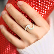 Load image into Gallery viewer, Opal Wave Ring displayed by being worn on a woman&#39;s finger.