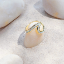 Load image into Gallery viewer, Opal Wave Ring is displayed by being placed on top of a smooth white rock.