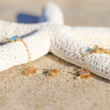 Load image into Gallery viewer, Open Sea Anklet displayed alongside a white dried artificial starfish on the beach.