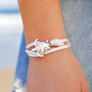 White Rope Sea Turtle Bracelet displayed by being worn around a woman's wrist.