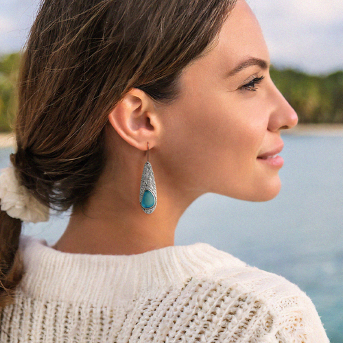 Rustic Sea Glass Drop Earring displayed by being worn on a woman's ear.