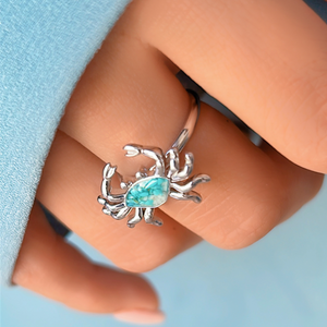 Sand Crab Ring displayed closely by being worn on a woman's finger.